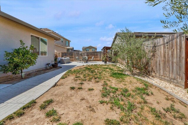 627 S Kandarian Ave, Fowler, CA 93625 - fenced backyard with a patio area