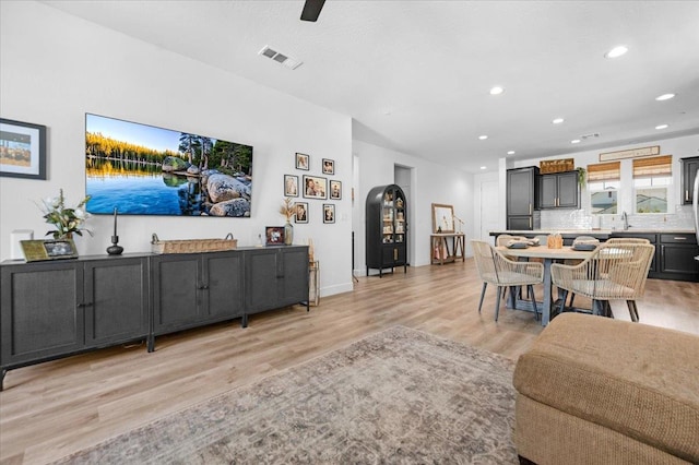 627 S Kandarian Ave, Fowler, CA 93625 - living room with light wood finished floors and recessed lighting