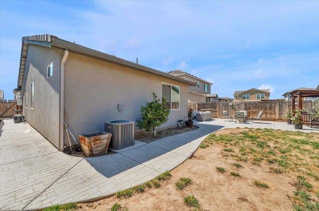 627 S Kandarian Ave, Fowler, CA 93625 - rear view of property with a patio area, stucco siding, and a fenced backyard