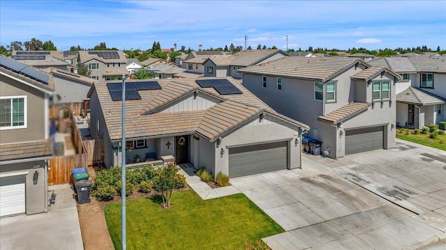 627 S Kandarian Ave, Fowler, CA 93625 - traditional-style home featuring a residential view, driveway, a tile roof, and stucco siding