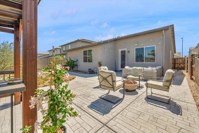 627 S Kandarian Ave, Fowler, CA 93625 - fenced backyard with an outdoor living space with a fire pit and a patio area