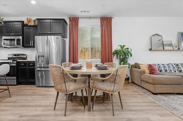 627 S Kandarian Ave, Fowler, CA 93625 - dining room featuring light wood-style floors and recessed lighting
