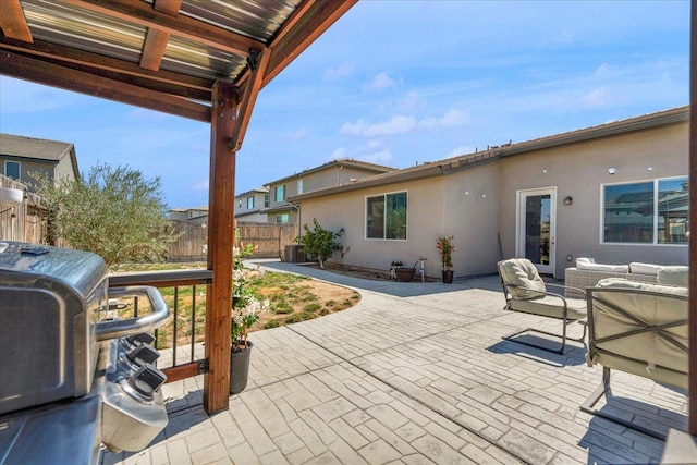 627 S Kandarian Ave, Fowler, CA 93625 - view of patio featuring an outdoor living space and a grill