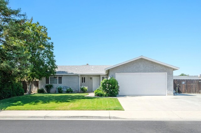1763 Norwich Ave, Clovis, CA 93611 - ranch-style home featuring an attached garage, stucco siding, and concrete driveway