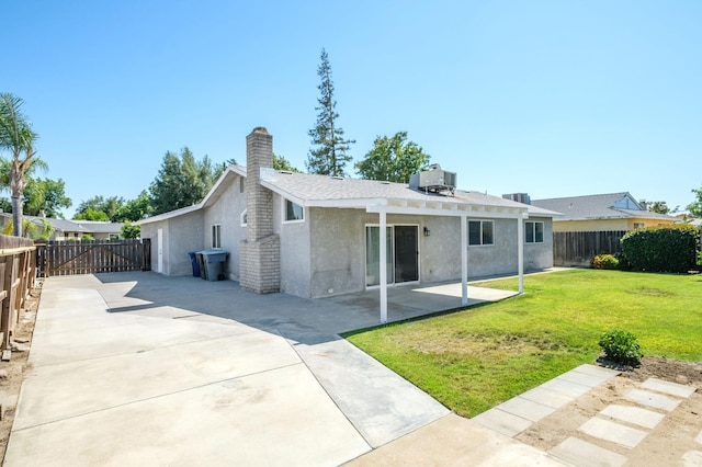 1763 Norwich Ave, Clovis, CA 93611 - back of house featuring stucco siding, a fenced backyard, a chimney, and a patio