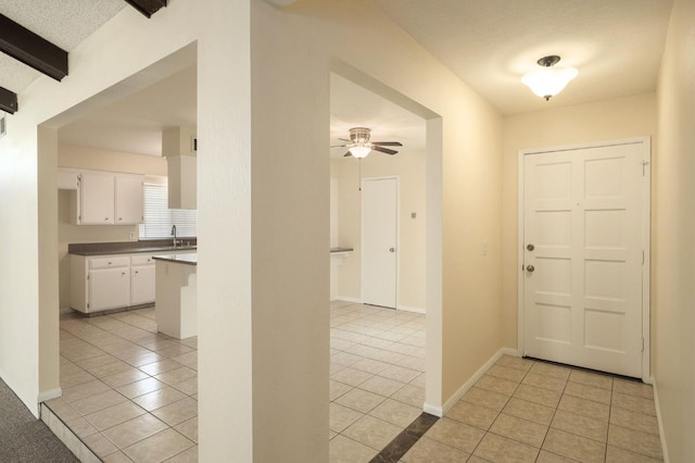 1763 Norwich Ave, Clovis, CA 93611 - foyer entrance featuring light tile patterned floors, a ceiling fan, and beamed ceiling