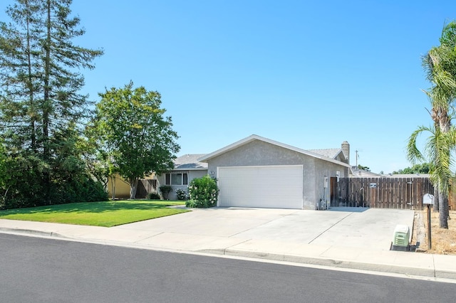 1763 Norwich Ave, Clovis, CA 93611 - single story home featuring a garage, stucco siding, driveway, and a chimney