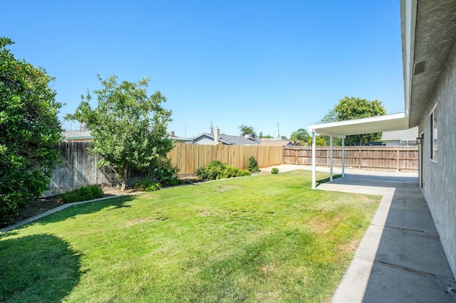 1763 Norwich Ave, Clovis, CA 93611 - fenced backyard with a patio area