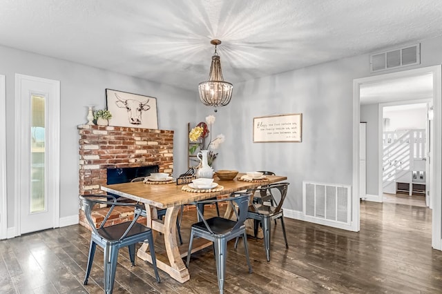 3377 N Bethel Ave, Sanger, CA 93657 - dining room with dark wood-style flooring and a chandelier
