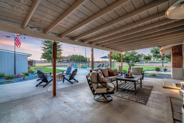 3377 N Bethel Ave, Sanger, CA 93657 - fenced backyard with a patio area, outdoor lounge area, and an outdoor structure