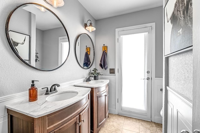 3377 N Bethel Ave, Sanger, CA 93657 - full bathroom featuring two vanities and tile patterned floors