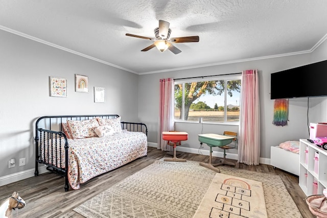 3377 N Bethel Ave, Sanger, CA 93657 - bedroom featuring crown molding, wood finished floors, a textured ceiling, and a ceiling fan