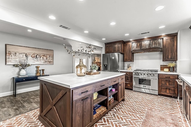 3377 N Bethel Ave, Sanger, CA 93657 - kitchen with appliances with stainless steel finishes, brick floors, light countertops, and recessed lighting