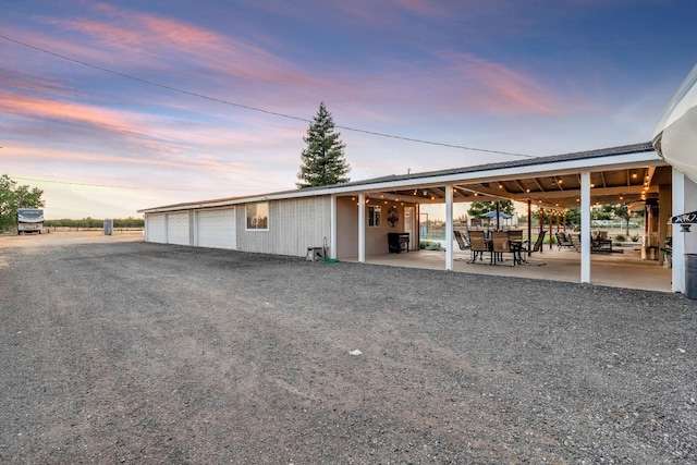 3377 N Bethel Ave, Sanger, CA 93657 - garage at dusk with a garage