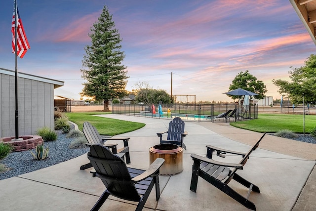 3377 N Bethel Ave, Sanger, CA 93657 - patio terrace at dusk featuring an outdoor fire pit and a patio