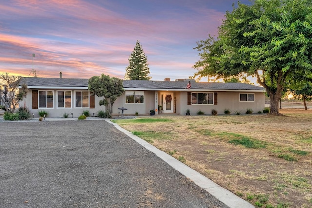 3377 N Bethel Ave, Sanger, CA 93657 - ranch-style house with gravel driveway and stucco siding