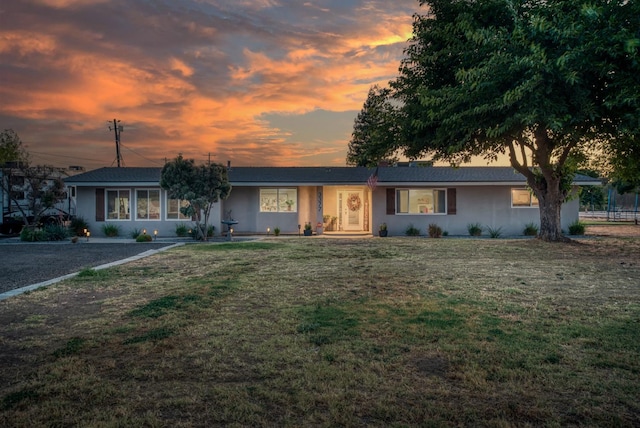 3377 N Bethel Ave, Sanger, CA 93657 - ranch-style house with a front yard and stucco siding