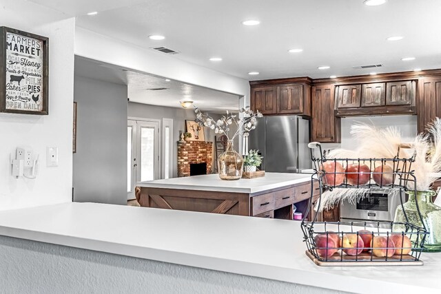 3377 N Bethel Ave, Sanger, CA 93657 - kitchen featuring freestanding refrigerator, light countertops, recessed lighting, and dark brown cabinetry