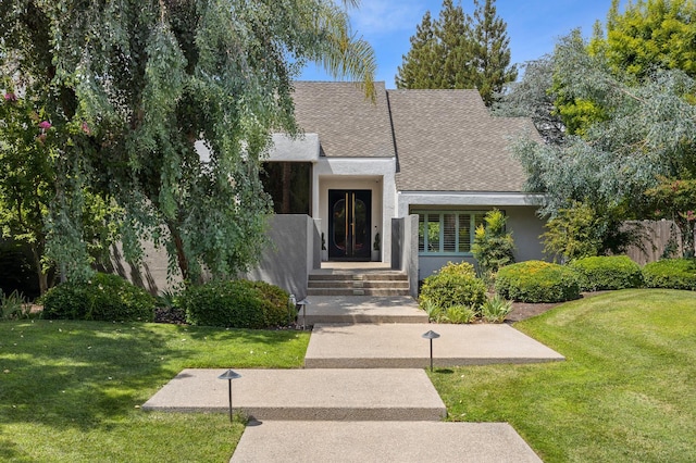2734 W Bluff Ave, Fresno, CA 93711 - view of front of house featuring stucco siding, a front yard, and roof with shingles