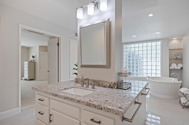 2734 W Bluff Ave, Fresno, CA 93711 - bathroom with vanity and a freestanding tub
