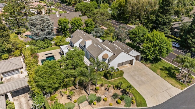 2734 W Bluff Ave, Fresno, CA 93711 - aerial overview of property's location with nearby suburban area and a tree filled landscape