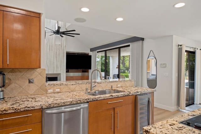 2734 W Bluff Ave, Fresno, CA 93711 - kitchen with stainless steel dishwasher, wine cooler, brown cabinetry, ceiling fan, and recessed lighting