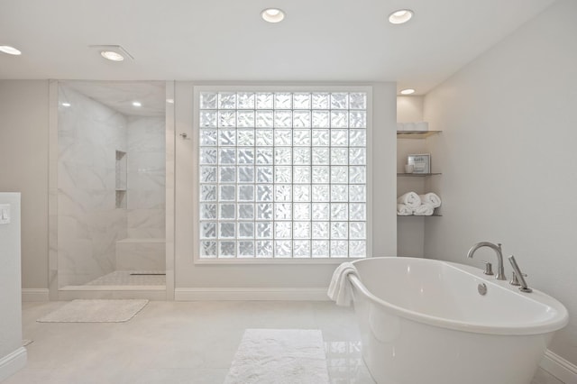 2734 W Bluff Ave, Fresno, CA 93711 - bathroom with a freestanding bath, a marble finish shower, recessed lighting, and tile patterned floors