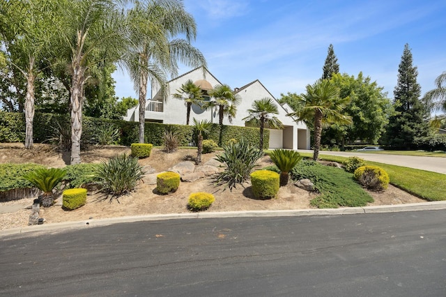 2734 W Bluff Ave, Fresno, CA 93711 - view of front facade featuring an attached garage and stucco siding