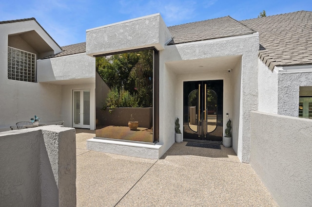 2734 W Bluff Ave, Fresno, CA 93711 - property entrance featuring french doors and stucco siding