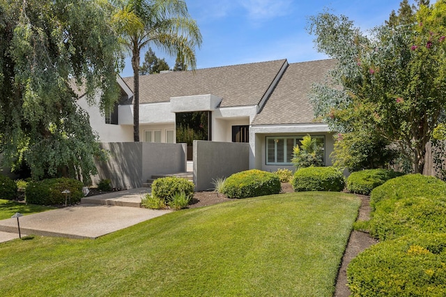 2734 W Bluff Ave, Fresno, CA 93711 - view of front of house with stucco siding and a patio area