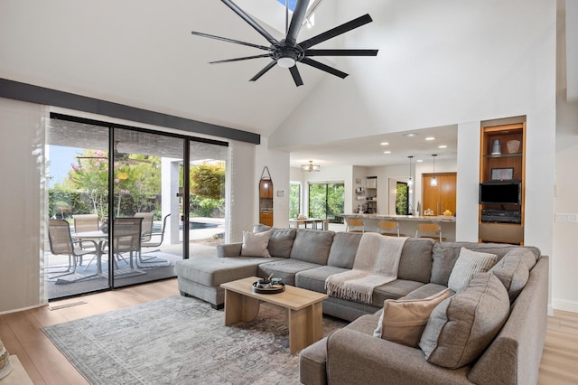 2734 W Bluff Ave, Fresno, CA 93711 - living area with high vaulted ceiling, light wood-style floors, a ceiling fan, and recessed lighting