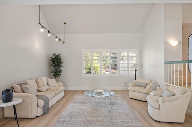 2734 W Bluff Ave, Fresno, CA 93711 - living area featuring vaulted ceiling and light wood-type flooring