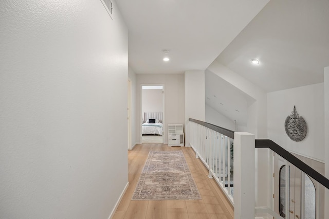 2734 W Bluff Ave, Fresno, CA 93711 - hallway with an upstairs landing, light wood-type flooring, recessed lighting, and radiator heating unit