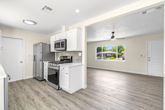 4729 E Cornell Ave, Fresno, CA 93703 - kitchen featuring stainless steel appliances, light wood-style flooring, light countertops, and a ceiling fan