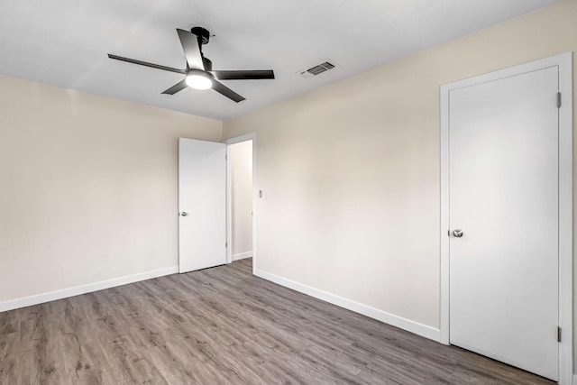 4729 E Cornell Ave, Fresno, CA 93703 - unfurnished bedroom with wood finished floors and a ceiling fan