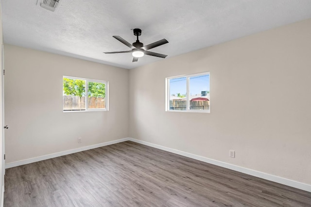 4729 E Cornell Ave, Fresno, CA 93703 - spare room with wood finished floors and ceiling fan