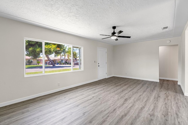 4729 E Cornell Ave, Fresno, CA 93703 - empty room featuring wood finished floors, a textured ceiling, and ceiling fan
