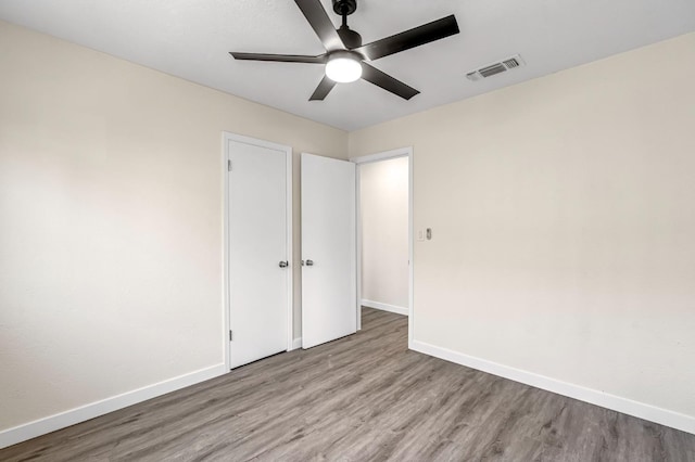 4729 E Cornell Ave, Fresno, CA 93703 - unfurnished bedroom with wood finished floors and ceiling fan