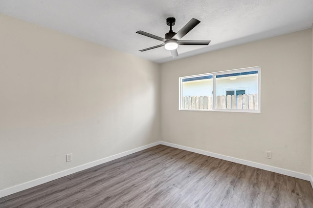 4729 E Cornell Ave, Fresno, CA 93703 - spare room featuring wood finished floors and ceiling fan