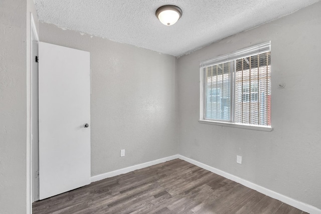 3137 E Townsend Ave, Fresno, CA 93702 - unfurnished room with a textured ceiling and wood finished floors