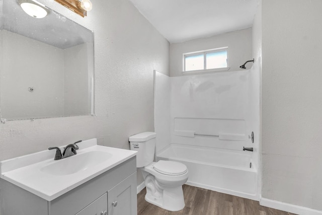 3137 E Townsend Ave, Fresno, CA 93702 - bathroom featuring wood finished floors, vanity, shower / bath combination, and a textured wall