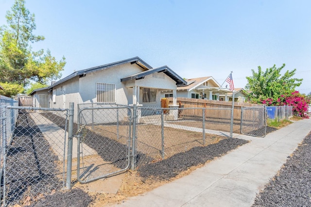3137 E Townsend Ave, Fresno, CA 93702 - bungalow-style house with a gate and stucco siding