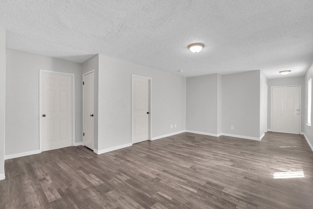 3137 E Townsend Ave, Fresno, CA 93702 - spare room with dark wood-type flooring and a textured ceiling