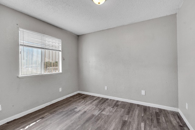 3137 E Townsend Ave, Fresno, CA 93702 - unfurnished room featuring wood finished floors and a textured ceiling