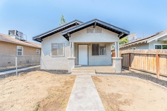 3137 E Townsend Ave, Fresno, CA 93702 - view of front of home featuring stucco siding and covered porch