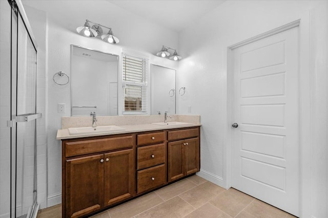 2062 N Osmun Ave, Clovis, CA 93619 - bathroom with double vanity, a stall shower, and tile patterned floors