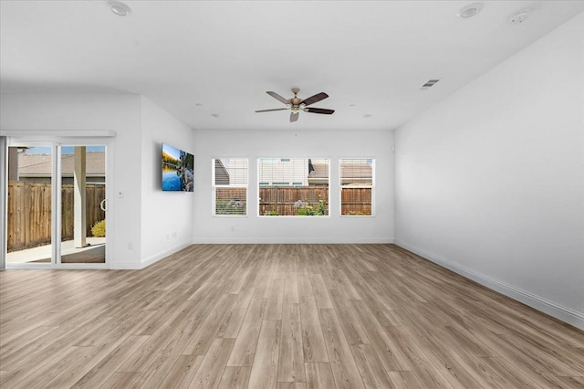 2062 N Osmun Ave, Clovis, CA 93619 - unfurnished living room with light wood-style floors and a ceiling fan