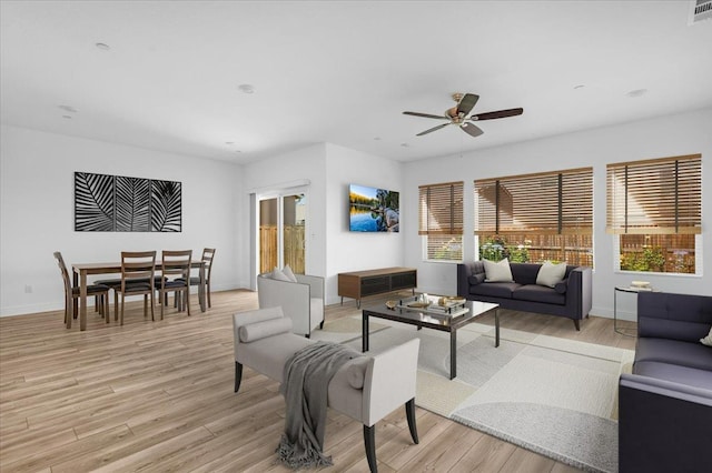 2062 N Osmun Ave, Clovis, CA 93619 - living room with light wood finished floors and ceiling fan