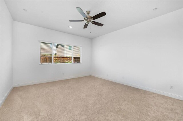 2062 N Osmun Ave, Clovis, CA 93619 - empty room with light colored carpet, ceiling fan, and recessed lighting
