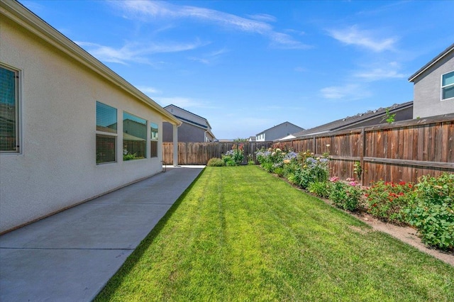 2062 N Osmun Ave, Clovis, CA 93619 - fenced backyard with a patio area